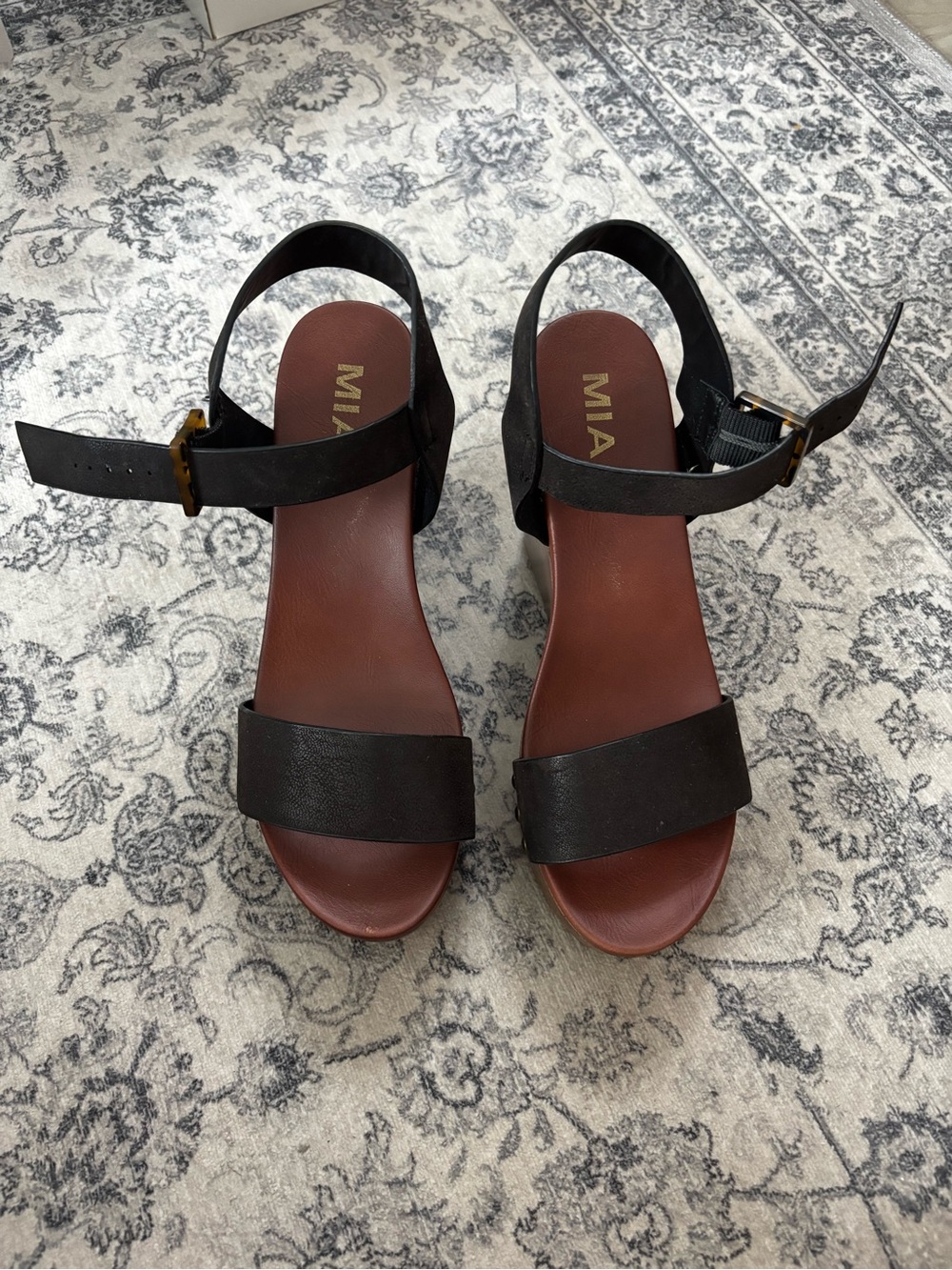 MIA Senna Black Leather Ankle-Strap Sandals with Brown Footbed and Gold Buckle